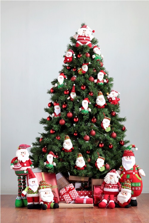 Bring Christmas to your home by decorating with oversized ornaments and Santa plushies as a topper.